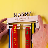 Personalised Children's Wooden medal hanger with their name cut out on top, and two lines for a custom engraved message