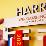 Laser engraved and Laser Cut Personalised Children's Wooden medal hanger with two brushed aluminium wall mounts provided