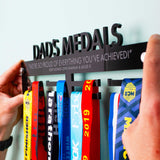 High Gloss Black Acrylic Personalised Medal Hanger featuring a laser engraved message over two lines