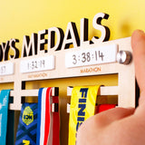Personalised Wooden Medal Hanger with four dry wipe sections to record personal best times for four events, and Brushed Aluminium Wall Mount Fixings