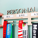 Personalised 'Personal Bests' Medal Hanger, with up to four drywipe sections to record best times for up to four distances