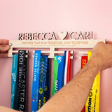 Wooden Personalised Couples Medal Hanger with both first names, a heart and an engraved message
