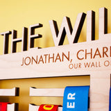 Detailed view of highly accurate laser engraving on Personalised Wooden Family Medal Hanger, featuring the surname and all the family's first names
