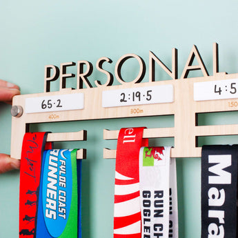 Personalised 'Personal Bests' Medal Hanger, with up to four drywipe sections to record best times  for up to four distances