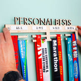 Laser Engraved and Laser Cut Personalised 'Personal Bests' Wooden Medal Hanger with four dry wipe sections to record personal best times for four events