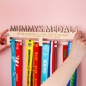 Personalised Medal hanger with 'Mummy's Medals' on top, with a cute message engraved over two lines