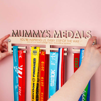 Personalised Medal hanger with 'Mummy's Medals' on top, with a cute message engraved over two lines