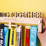 Laser Engraved and Laser Cut Wooden medal holder with 'Running Together' text, personalised with two lines of custom text