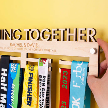 Laser Engraved and Laser Cut Wooden medal holder with 'Running Together' text, personalised with two lines of custom text