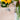 Table number sign with floral design and flowers in the background