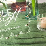 Decorative acrylic plaque with 'Table Eight' on a green tablecloth with candles and vases.